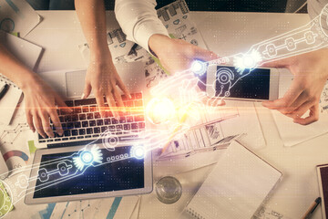 Double exposure of man and woman working together and data theme hologram drawing. Computer background. Top View.