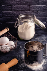 Table with baking products and tools.