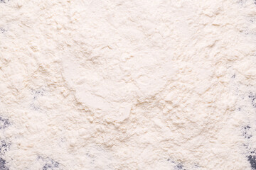 Baking or cooking background, flour on the dark background.