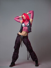 Futuristic fashion, a young bright and attractive woman with pink hair,