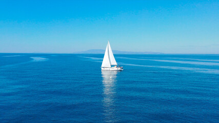 Obraz premium Aerial view of sailing luxury yacht at opened sea at sunny day in Croatia