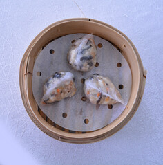 steamed fresh seafood prawn pork meat crystal dumpling ball har gao in bamboo basket Hong Kong vegan dim sum menu
