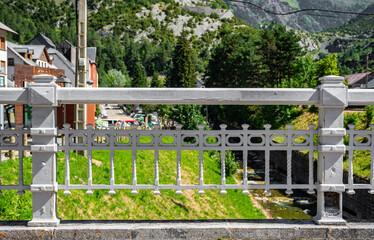 Old railing of a bridge at The Canfranc Station on white colour, Huesca, Aragon, Spain