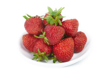 Fresh red strawberries on white plate. Isolated on white