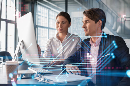 Businessman and businesswoman in formal wear working together to optimize business process by applying new technologies. Hi tech holograms over modern office background with panoramic windows - Powered by Adobe