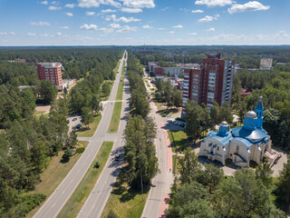 Aerial view of Visaginas town highest building and Orthodox church. Visaginas, Lithuania. June 2021