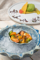 salmon ceviche with avacado and passionfruit sauce