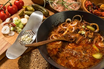 Traditional Hungarian beef stew stew. Goulash with onion and garlic. Spicy food.