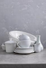 Fototapeta na wymiar Empty crockery set or white ceramic dishes. White kitchen dishware and tableware on table
