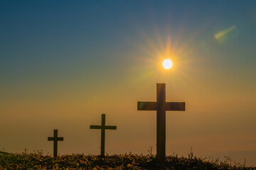 The crucifixion of Jesus Christ at the sunrise - Silhouette Three Crosses On Hill
