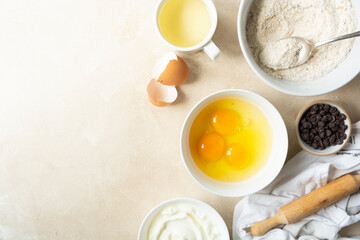 Ingredients for baking: eggs, flour rolling pin for cooking delicious food or dessert. Top view, copy space.