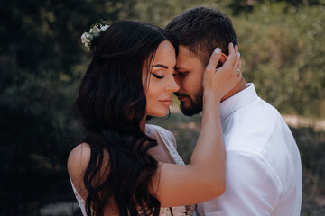 bride and groom. Luxurious young couple of newlyweds in love posing for the first family wedding photo shoot