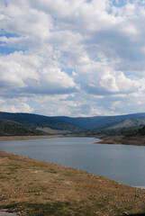 A body of water on a cloudy day 