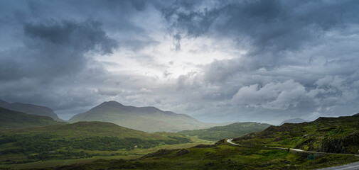 Panoramic view of Irish landscape from Ladies View in Killarney National Park, with a sky with very...