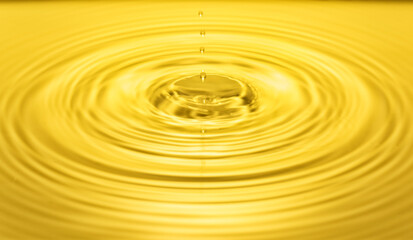 falling drops on the water surface, splash, ripples on the water, yellow color