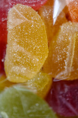 Sweet, colorful jelly fruits in transparent packaging invite you to enjoy them.