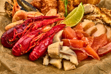 Plate with fresh assorted seafood, shrimps, crayfish, mackerel, isolated on white background. High resolution image.