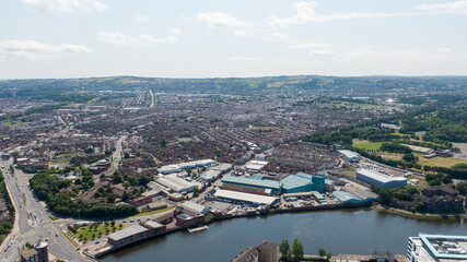 Aerial view on river and buildings in City center of Belfast Northern Ireland. Drone photo, high angle view of town