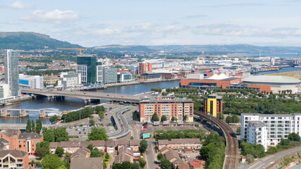 Obraz premium Aerial view on river and buildings in City center of Belfast Northern Ireland. Drone photo, high angle view of town