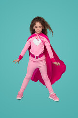 Brave superhero girl in pink costume