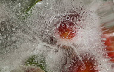 Ice texture with small round plums inside the layer of ice
