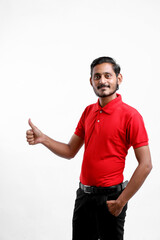 Happy Asian man in t-shirt and showing expression isolated over white background.