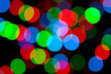 Festive multicolored bokeh background. Abstract blurred colored lights.