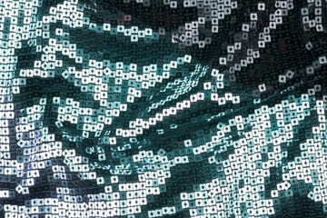 Texture of the surface of the fabric made of sequins. Fashion fabric glitter, sequins. beautiful shiny texture background
