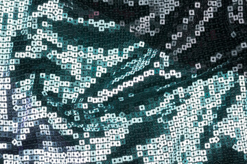 Fototapeta premium Texture of the surface of the fabric made of sequins. Fashion fabric glitter, sequins. beautiful shiny texture background
