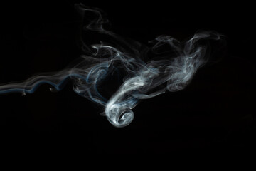 Abstract smoke isolated on black. White smoke on a black background.