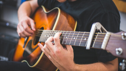 Fototapeta na wymiar musician playing acoustic guitar