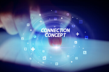 Finger touching tablet with social media icons concept