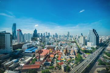 Fototapeta premium Bangkok Cityscape view with beautiful scenery blue sky and cloud in the day time.Bangkok is the capital and most populous city of Thailand.