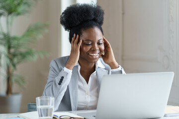 Overjoyed african american office worker businesswoman female read positive news email with job...