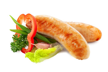 Homemade sausages. Grilled Bavarian sausages with green lettuce, isolated on white background. Sausage bratwurst grill cutout. Fried sausages.