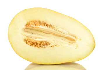 One half organic ripe yellow melon, close-up, isolated on white.