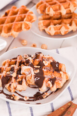 Waffles with chocolate cream and hazelnuts.