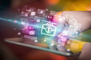 Close-up of a hand using tablet, currency concept