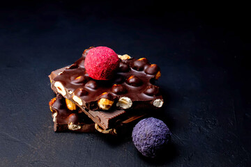 Chocolates background. Chocolate. Assortment of fine chocolates in white, dark, and milk chocolate. Praline Chocolate sweets
