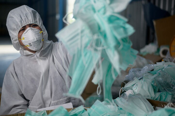 Used medical mask in Waste recycling plants during covid-19 and pandemic.