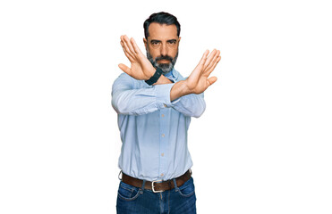 Fototapeta premium Middle aged man with beard wearing business shirt rejection expression crossing arms and palms doing negative sign, angry face