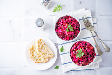 Beet potatoes green peas carrots pickled cucumbers salad