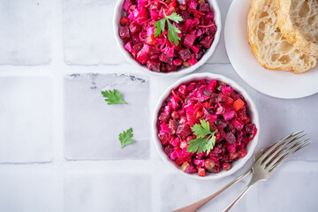 Beet potatoes green peas carrots pickled cucumbers salad