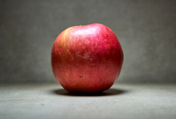 Close up of ripe red apple with dark background 