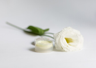 Cream in a jar on a white background