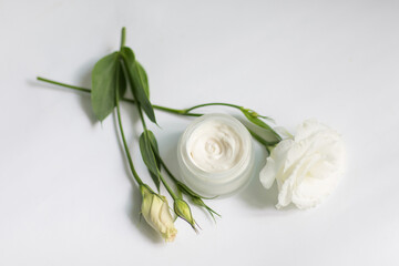 Cream in a jar on a white background