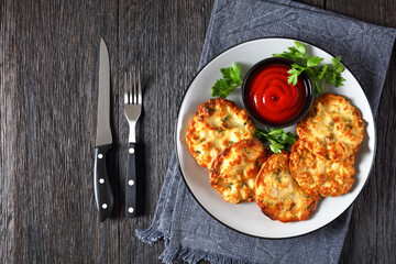 Cheesy Chicken Fritters on a plate, top view