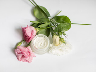 Cream in a jar on a white background