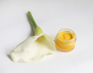Cream in a jar on a white background
