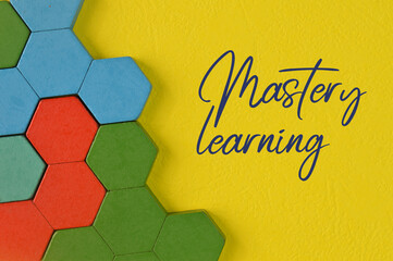 Colorful wooden blocks and phrase MASTERY LEARNING. Education concept.